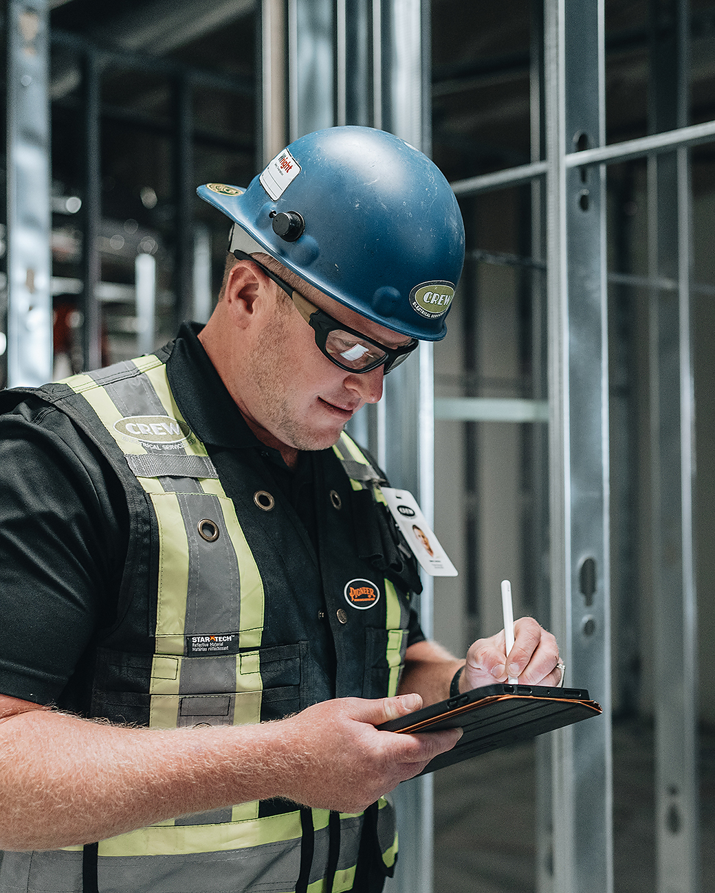 A licensed Crew Technical Services electrician working on a commercial electrical project.