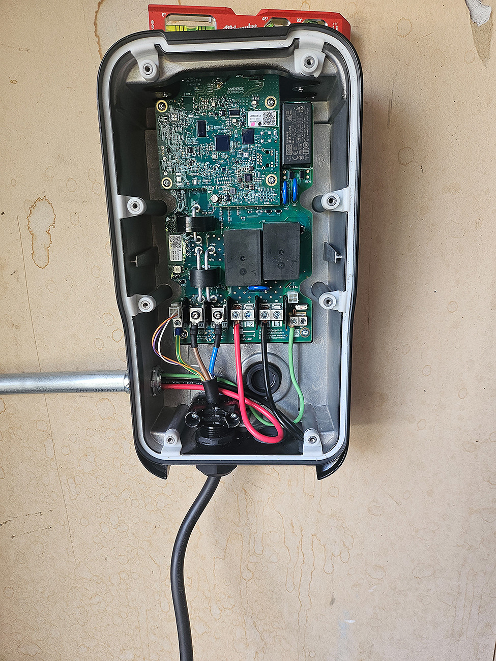 EV Charger Installation in Calgary, AB | Crew Technical Services EV Charger Installation on exterior wall – Crew Technical Services Calgary.