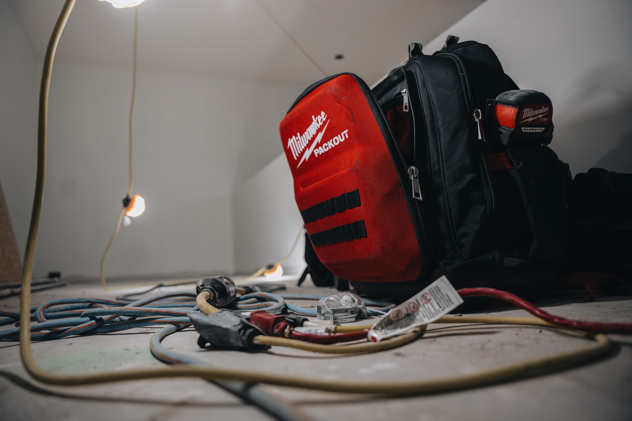Crew Technical Services electrician working in an Airdrie utility room