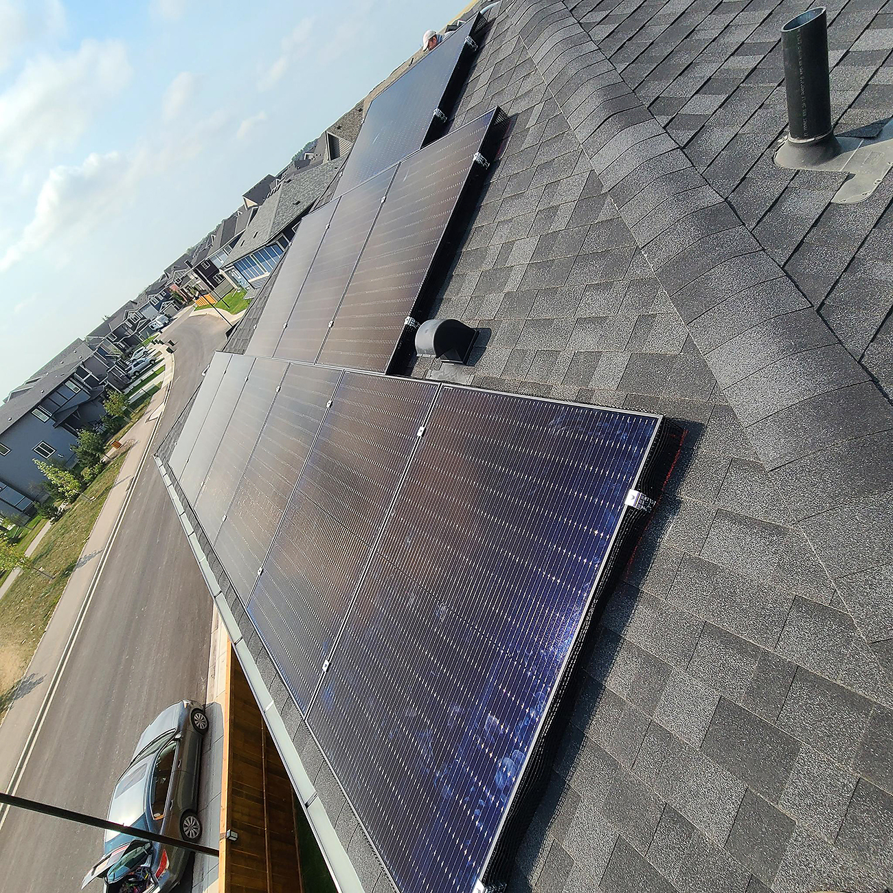 Solar panel installations in Calgary by Crew Technical Services with clean roof layout and tidy conduit