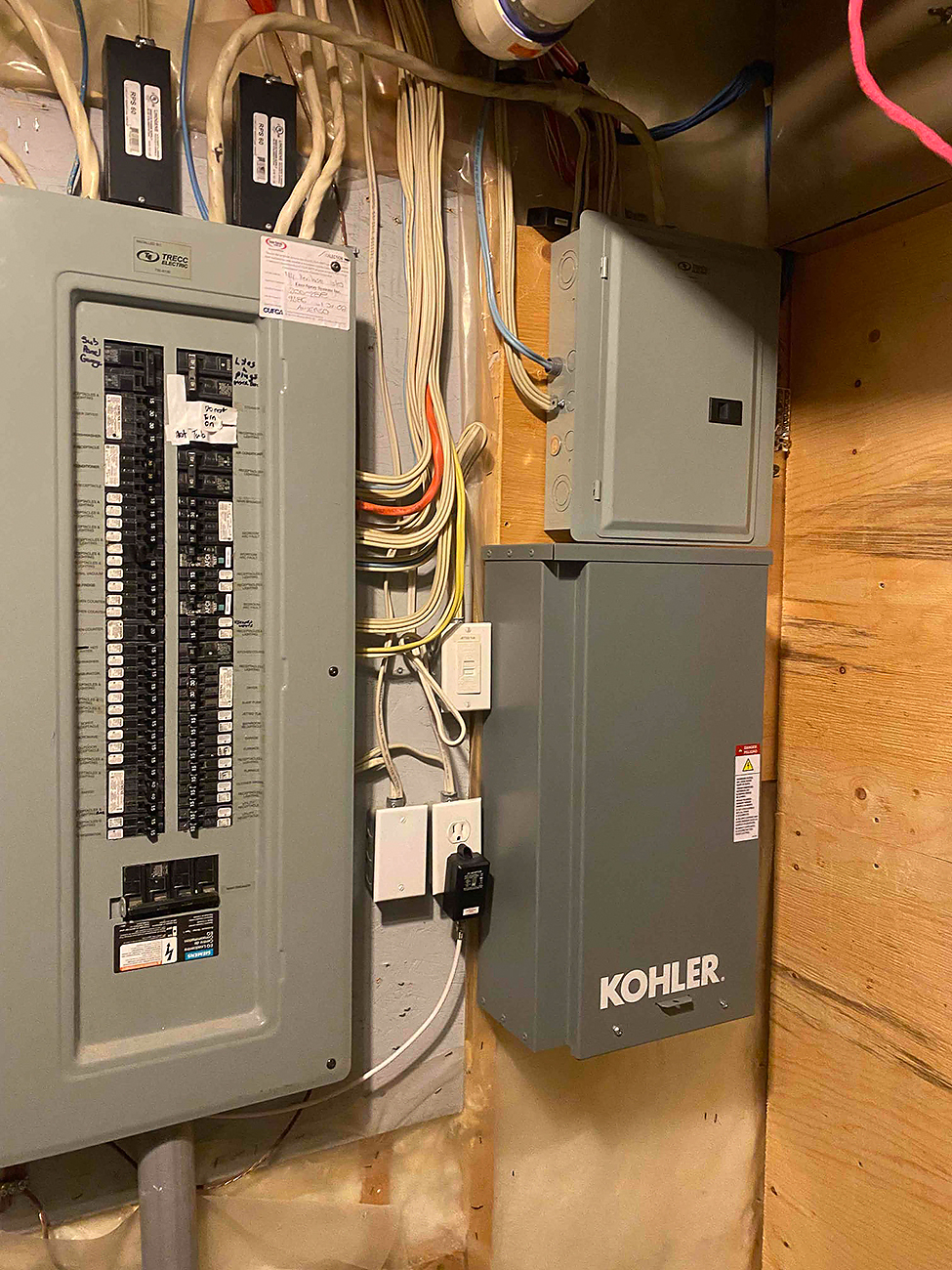 Electrical Panel Upgrade in Calgary | Crew Technical Services Crew Technical Services placing a whole home surge protector next to a Calgary electrical panel, short leads and tidy routing