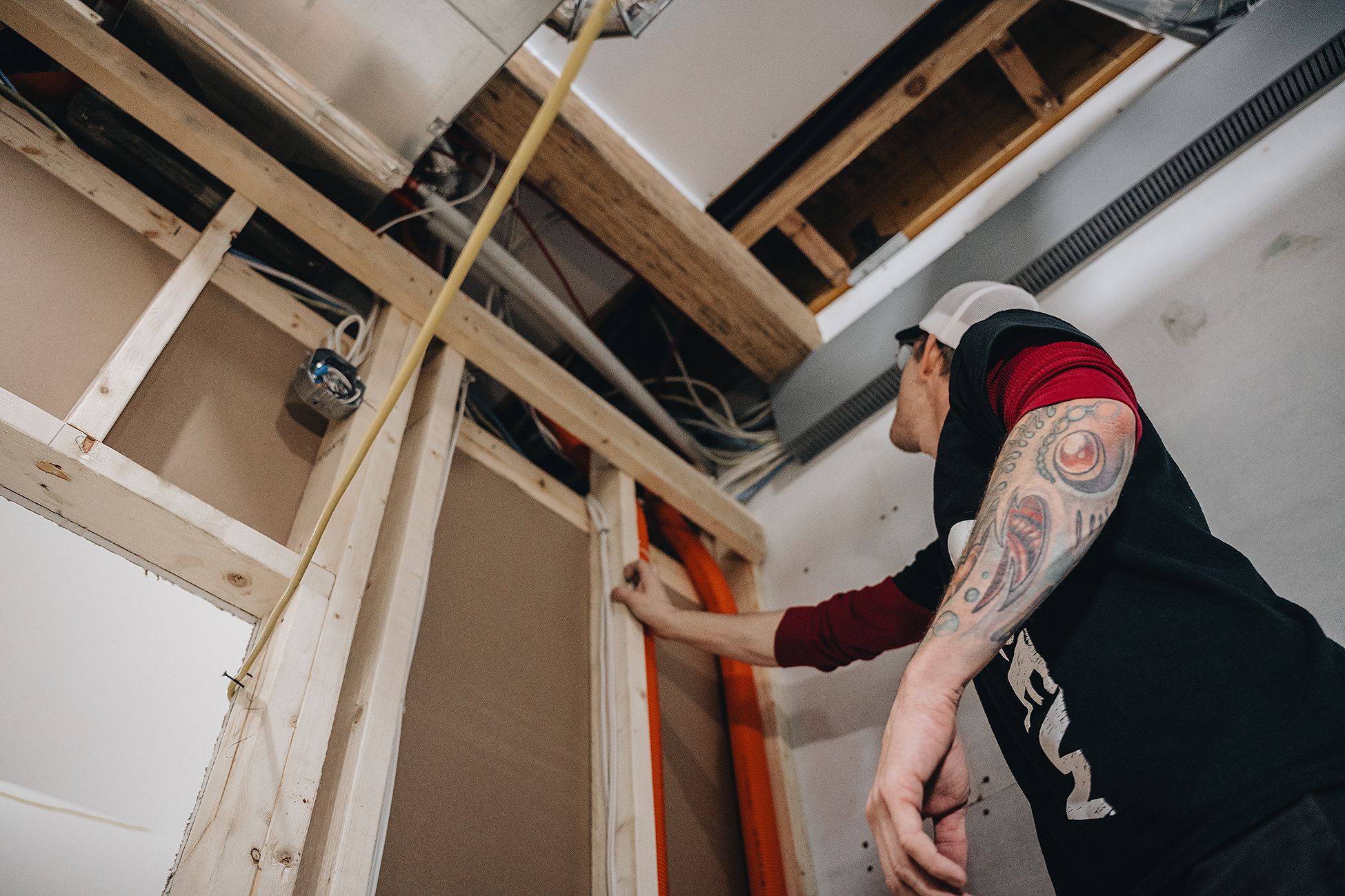 Electrical for Home Renovations in Calgary | Crew Technical Services Basement electrician in Calgary — media wall power and low-voltage paths installed by Crew Technical Services