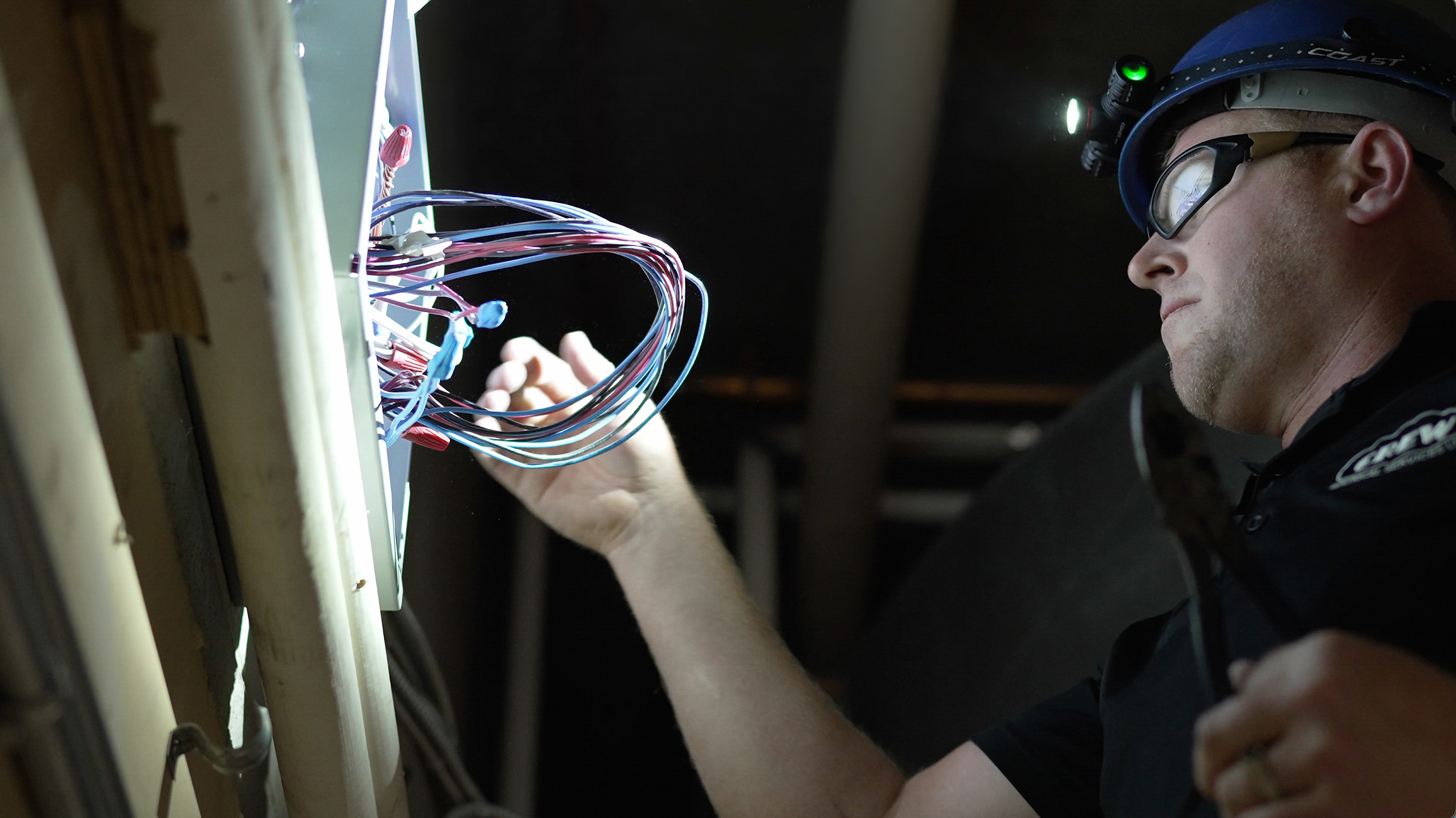 Crew Technical Services technician working on a commercial electrical panel upgrade