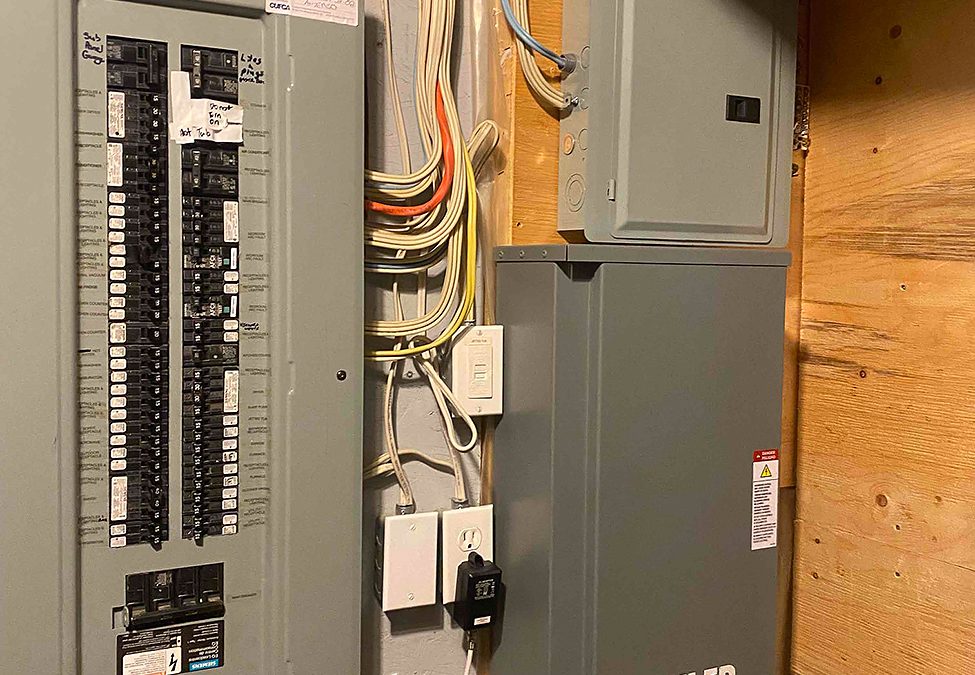 Older wiring being assessed inside the walls of a Calgary home for sale