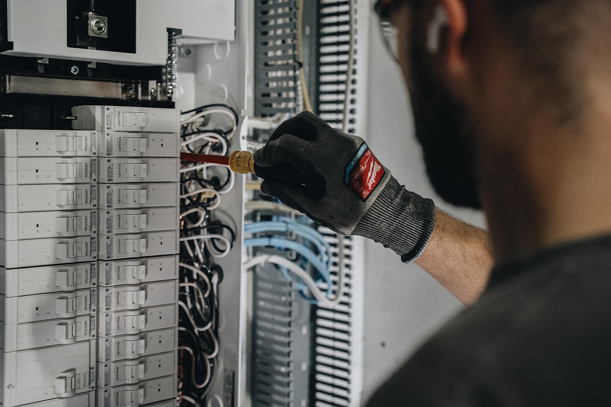 Crew Technical Services electrician completing a panel upgrade in Cranston