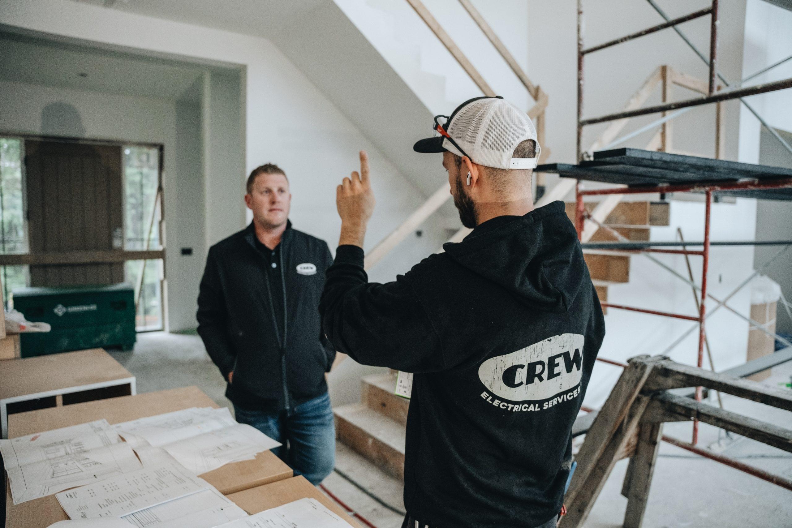 Crew Technical Services electrician working in an Arbour Lake home in northwest Calgary